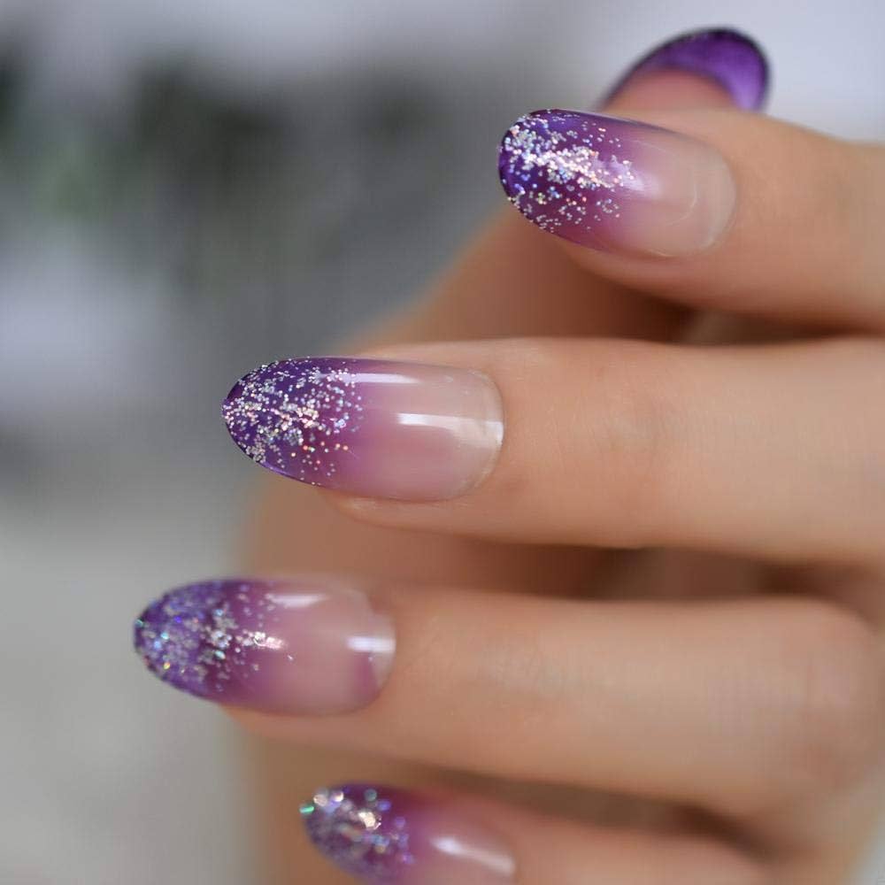 A woman's hand with round nails, adorned with purple and silver glitter.