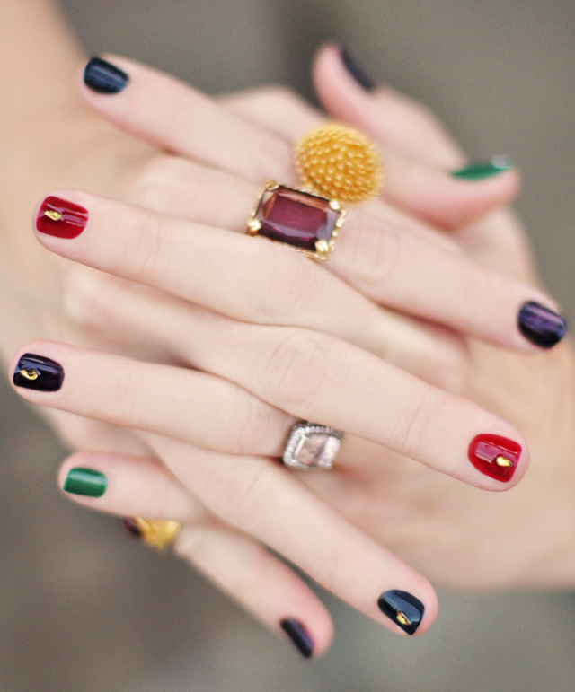  Luxurious jewel-toned manicure on a woman's hands. fall 2023 nail colors