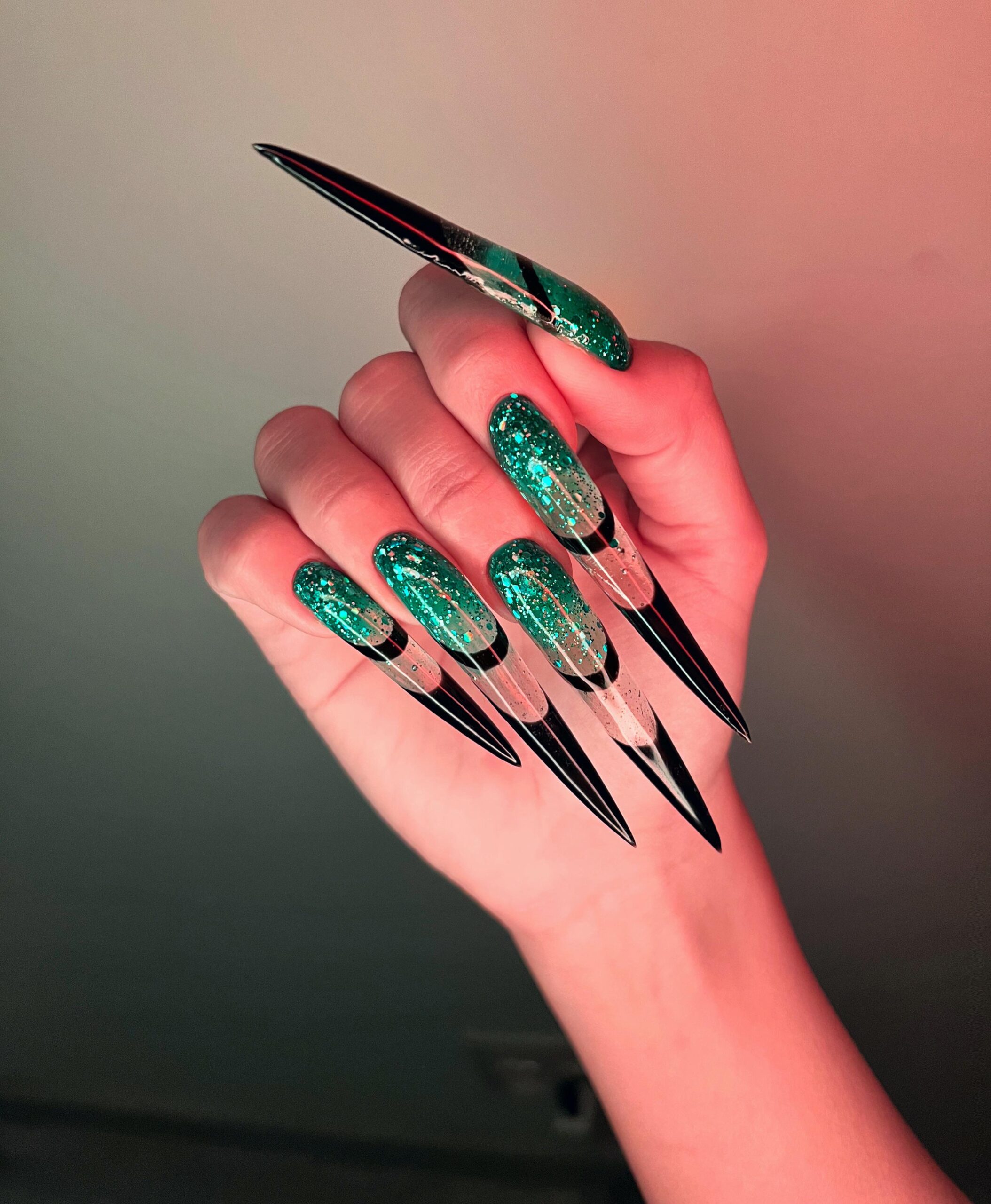 A woman's hand with stiletto nails, with wonderful and exotic nail art