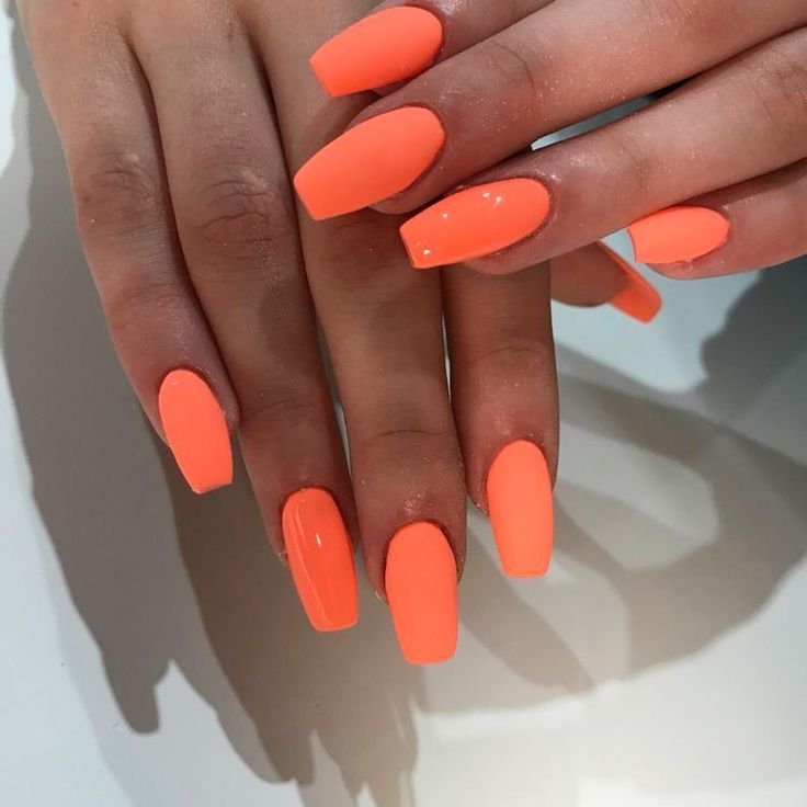 Woman's hands with tropical nail polish