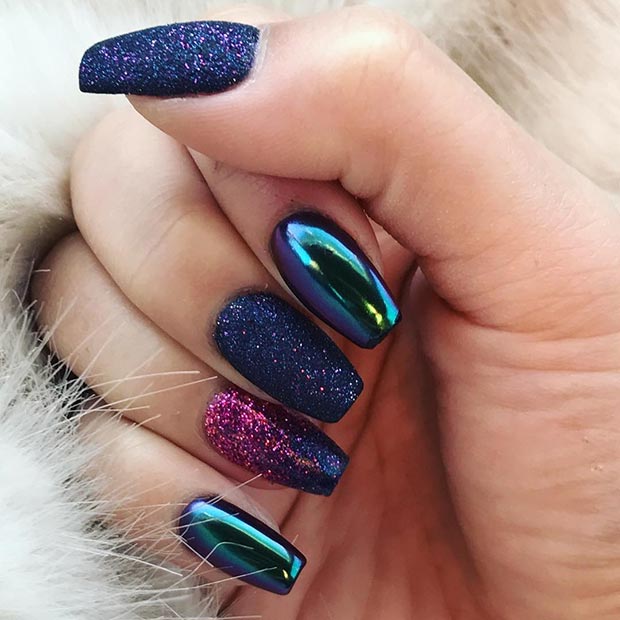 A woman's hand with Metallic Marvels nail art, party nail trends