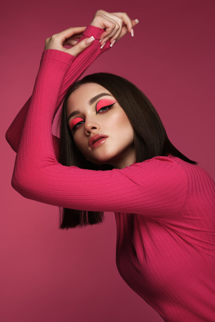 beautiful-brunette-woman-in-pink-clothes-with-pin-2023