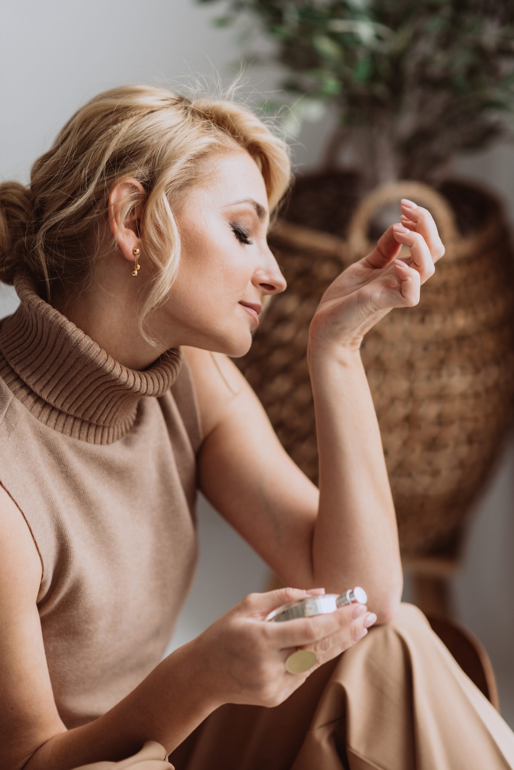 young-beautiful-woman-holds-a-bottle-of-perfume-in-2022-11-14