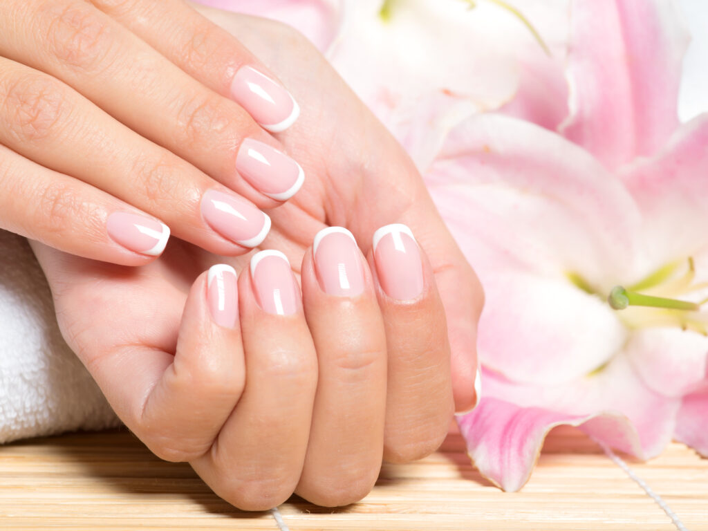 beautiful-woman-s-nails-with-french-manicure-2021-08-26