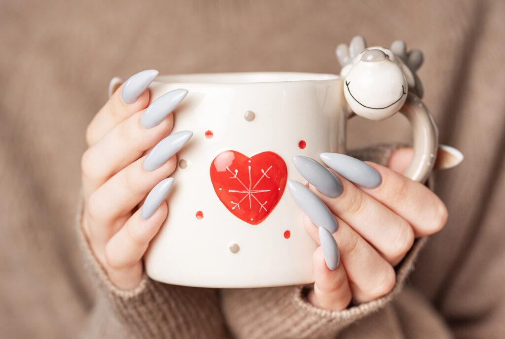 close-up-of-woman-s-hand-with-grey-nail-polish-2023-11-08