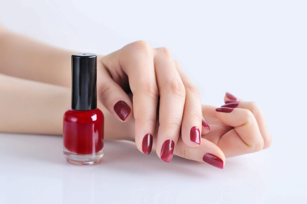 hands-of-a-woman-with-dark-red-manicure-and-nail-p-2021