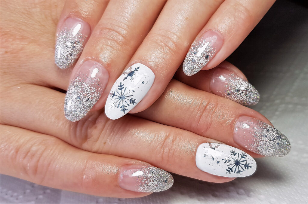 a professional modern gel manicure. Silver nails. Winter Nails. Winter 2023 Nail Trends