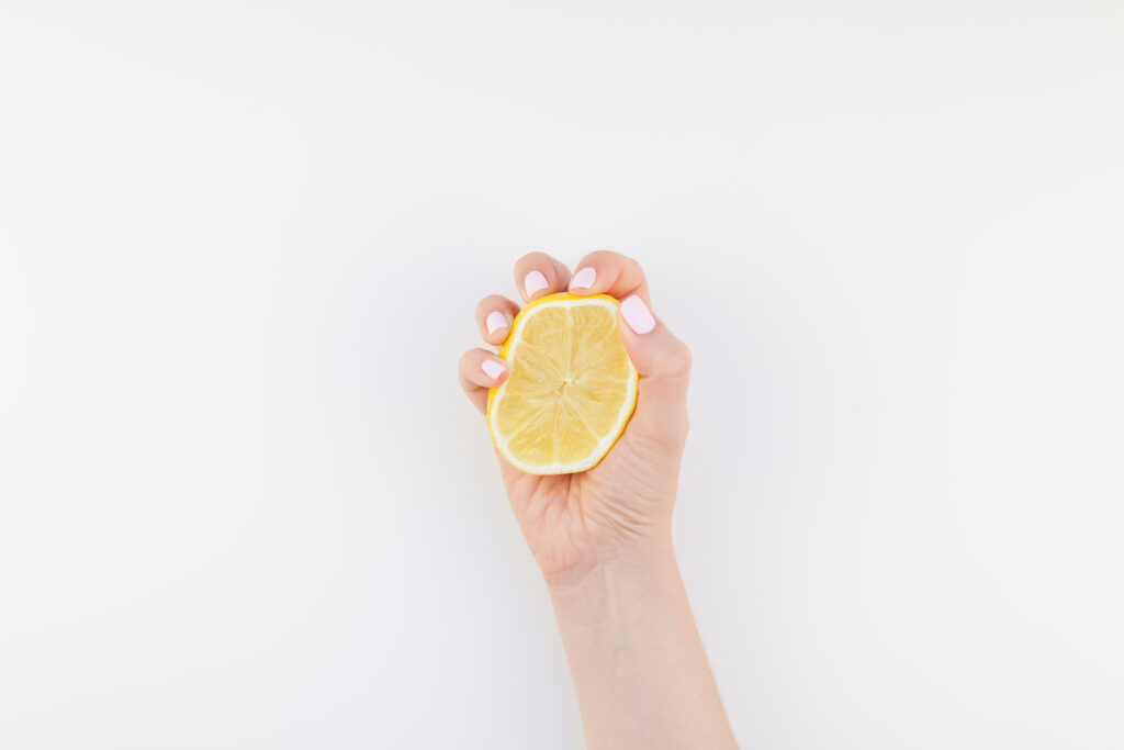 woman-hand-with-lemon-2021-09-01