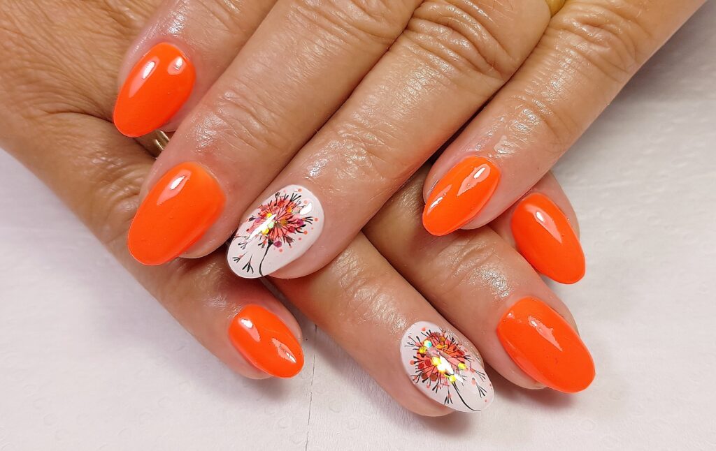 A closeup of a woman's hands with professionally manicured fingernails painted with gel, Summer Nail Trends