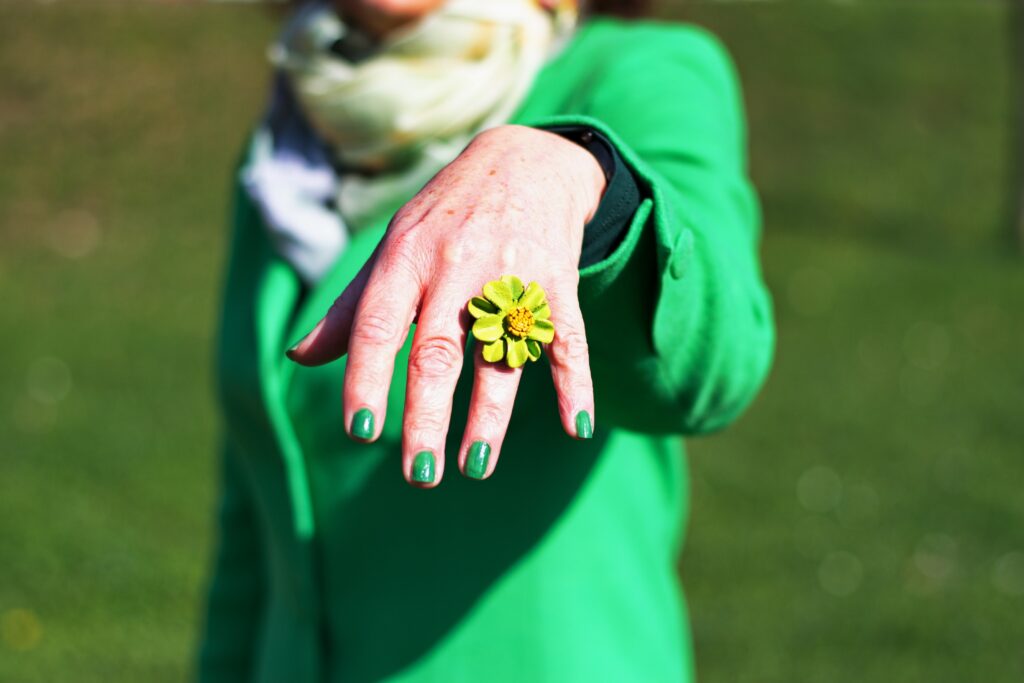 closeup-of-mature-s-woman-hand-posing-with-green-n-2023-11-27-05-07-52-utc