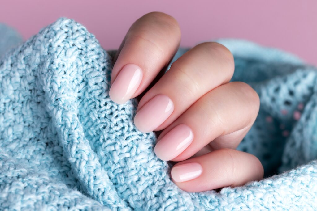 hand-in-sweater-with-nude-nails-2023-11-27