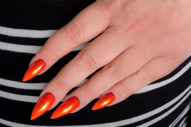 woman hand with red stiletto nails