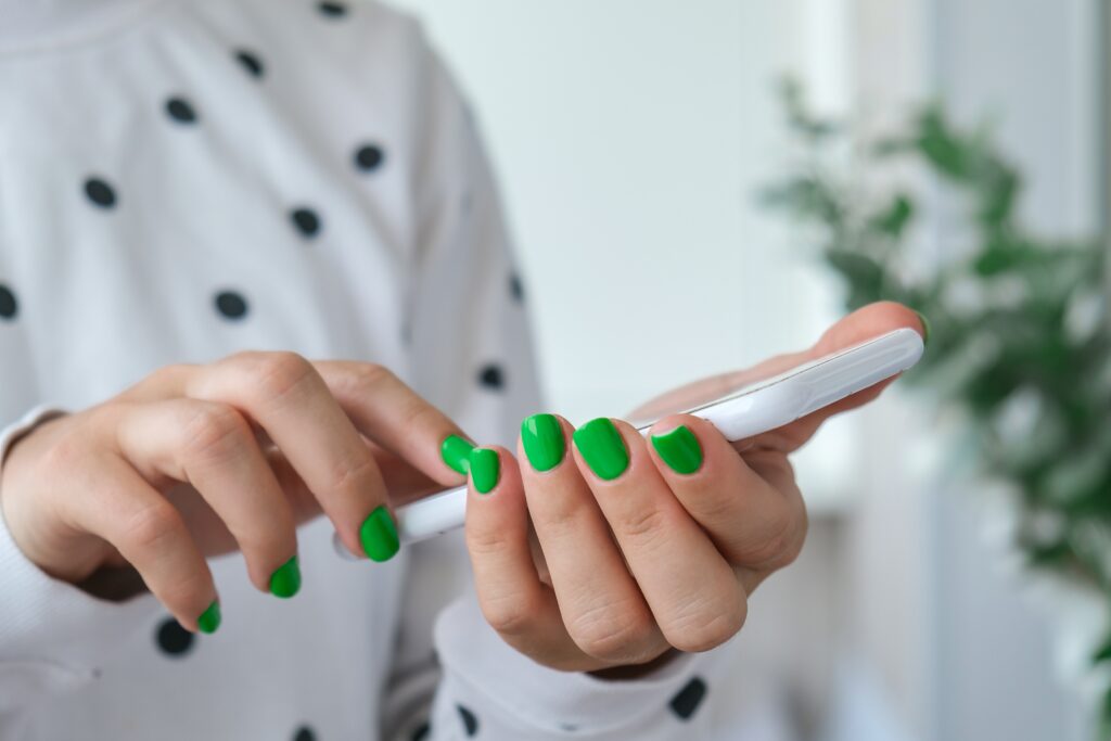 manicured-female-hands-with-stylish-green-nails-ho-2023-11-27