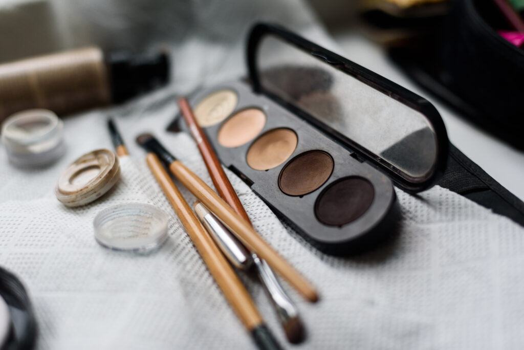 makeup artist tools, brushes, shadows on the table. eyeliner tools
