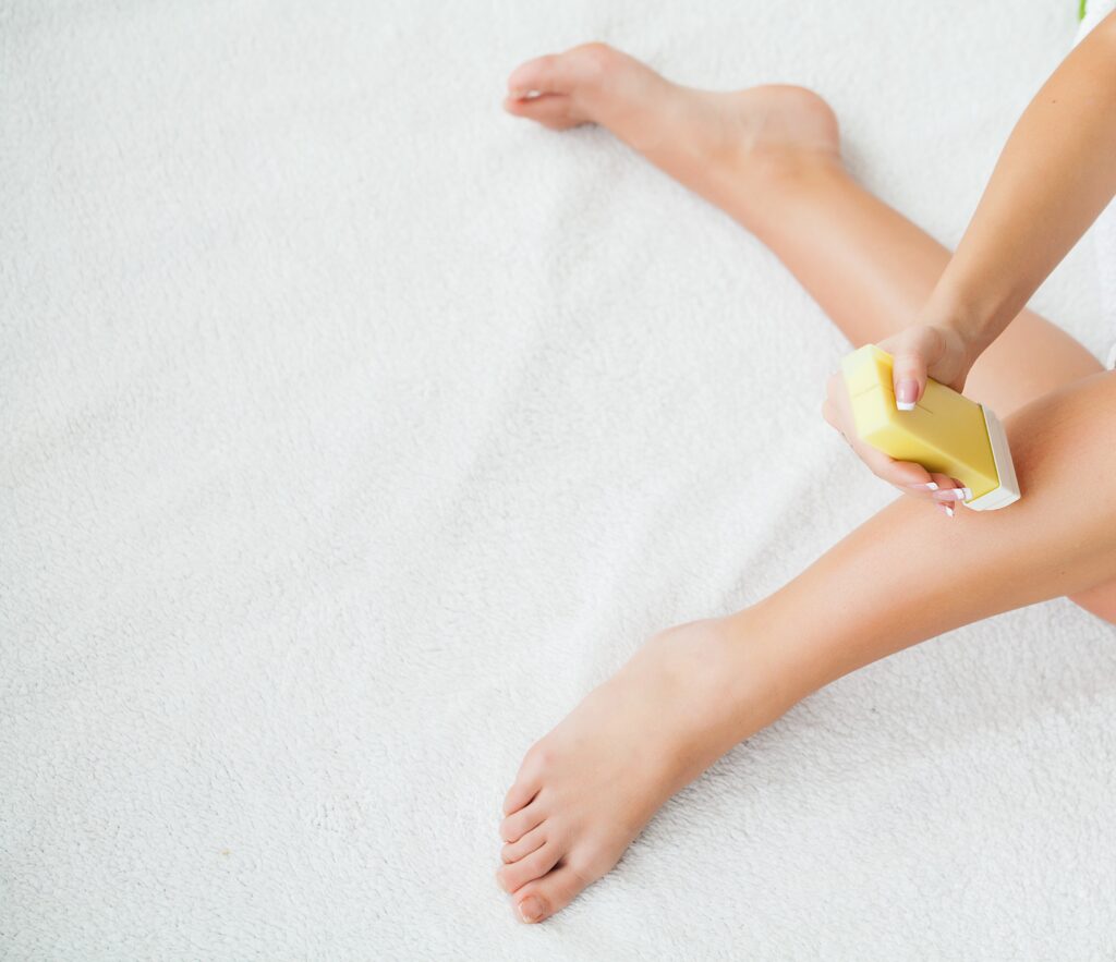 Sugaring: epilation with liquate sugar at legs. Soft wax, hair removal