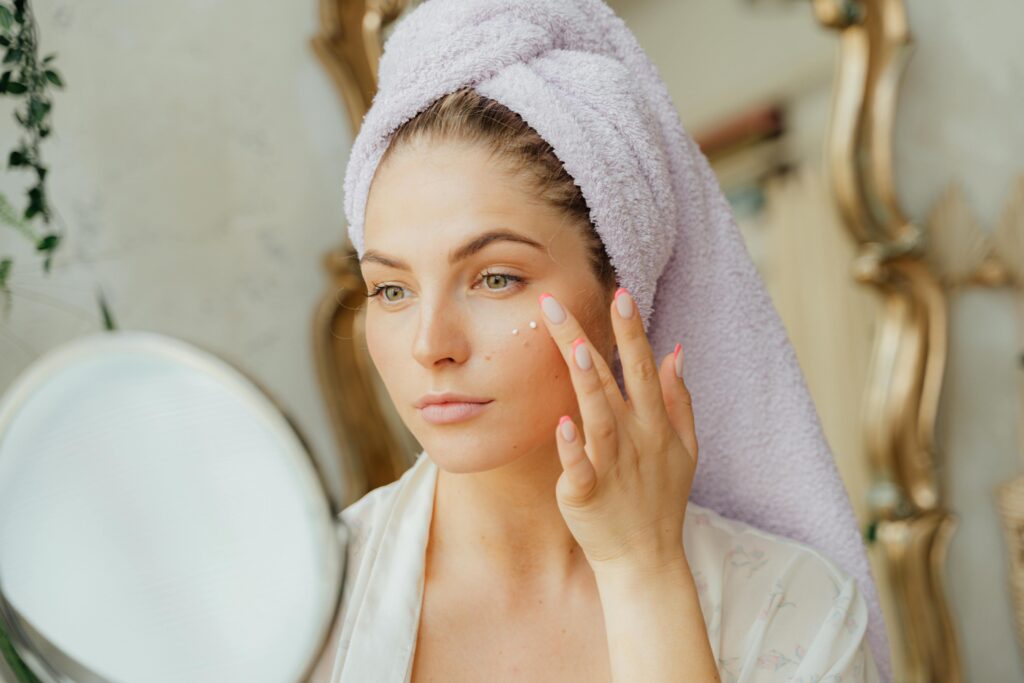 a beautiful girl is doing her morning skincare routine