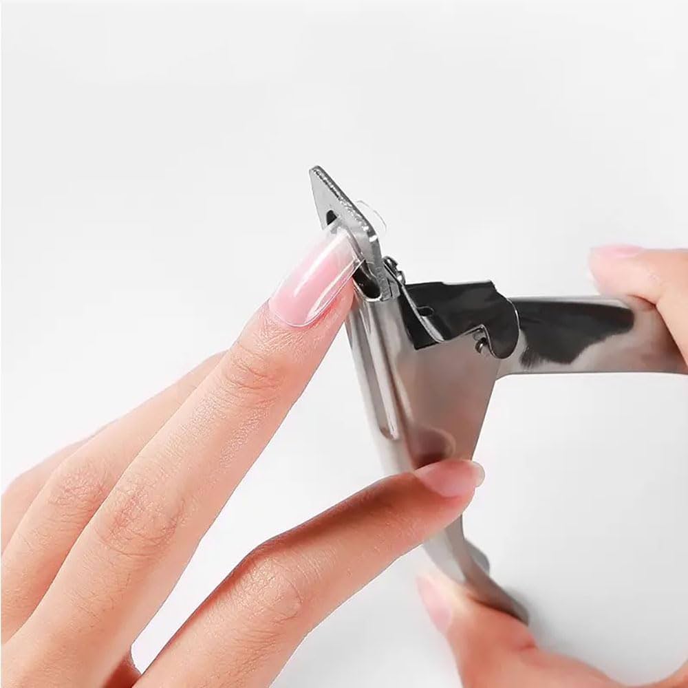 A faceless woman using nail tip slicer to remove the tips of the nail tips.