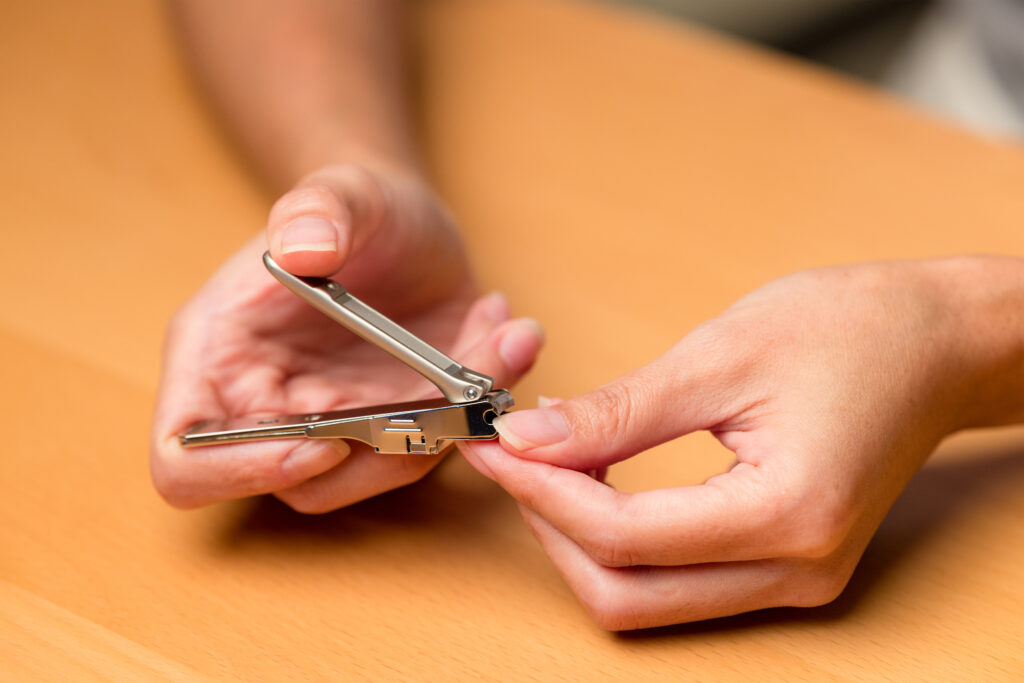 Hand manicure with nail clipper. nail cutting tools