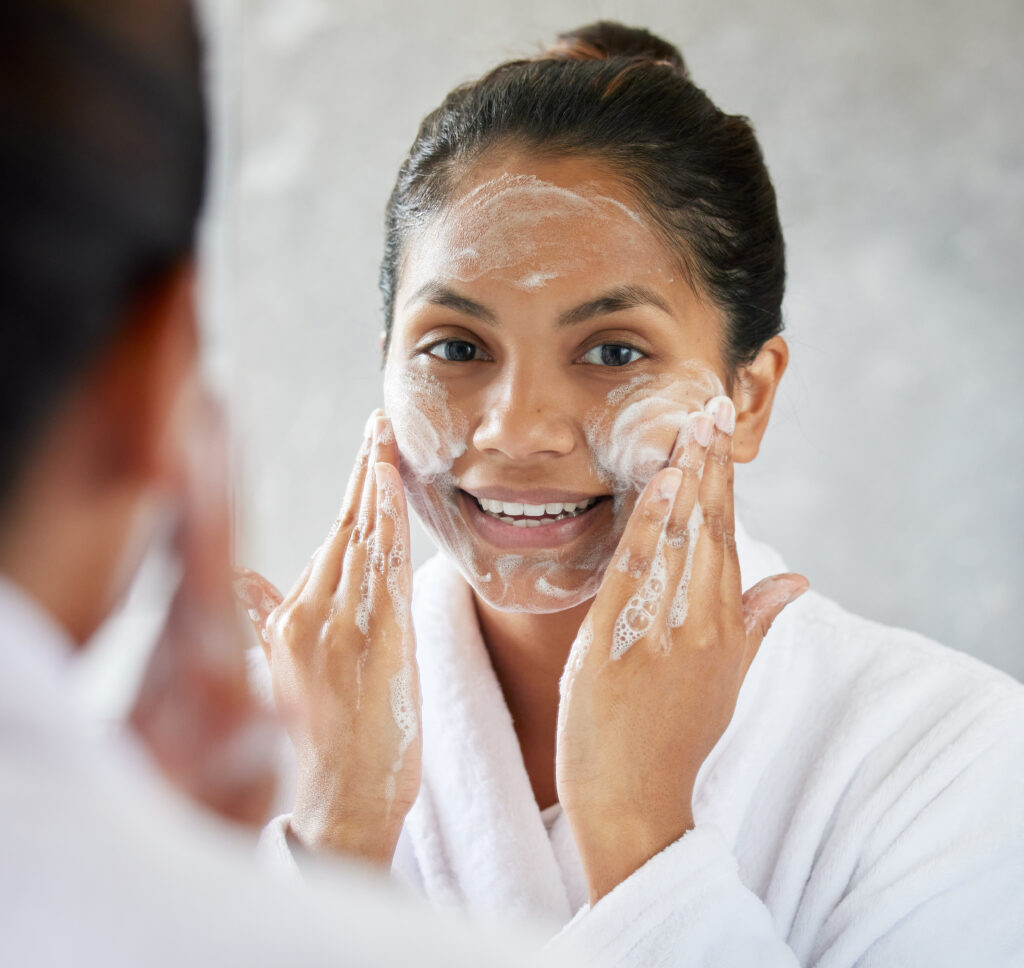 Makeup is ART, Beauty is SPIRIT. Shot of young woman using with facial moisturiser. face wash cleansers