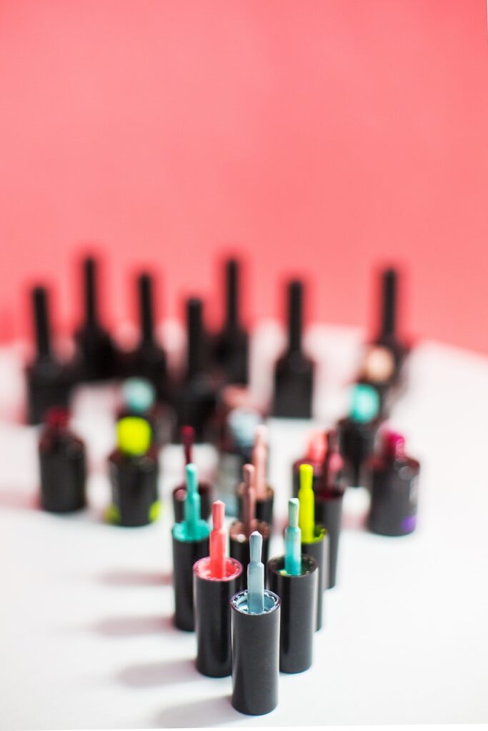 Opened bottles with gel polish of different colors.  nail polish for fair skin