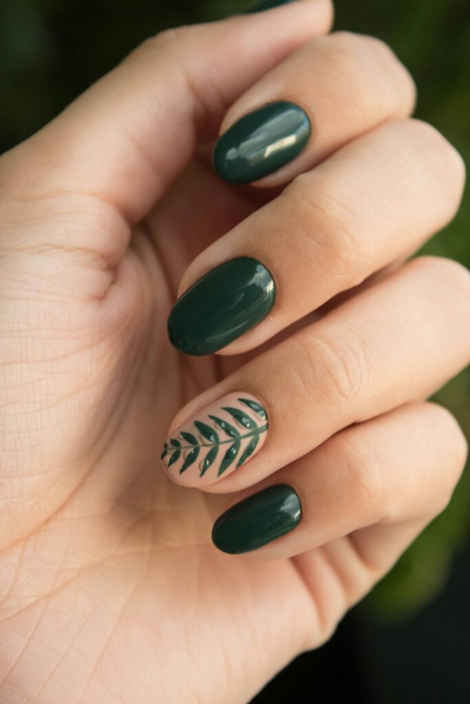 A faceless woman with green nail polish shade and some green designs