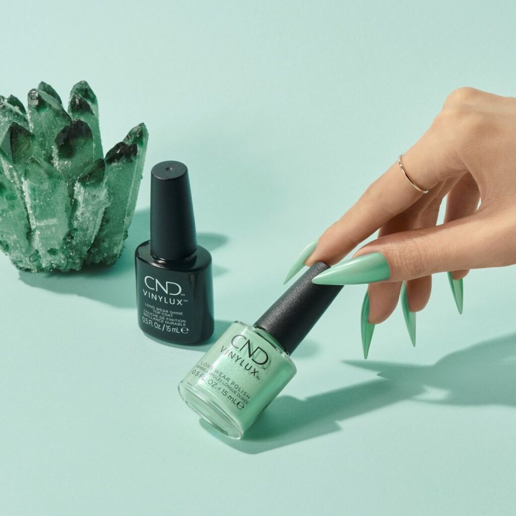 CND Vinylux shade bottle, mint green beside CND Vinylux CND Vinylux base coat