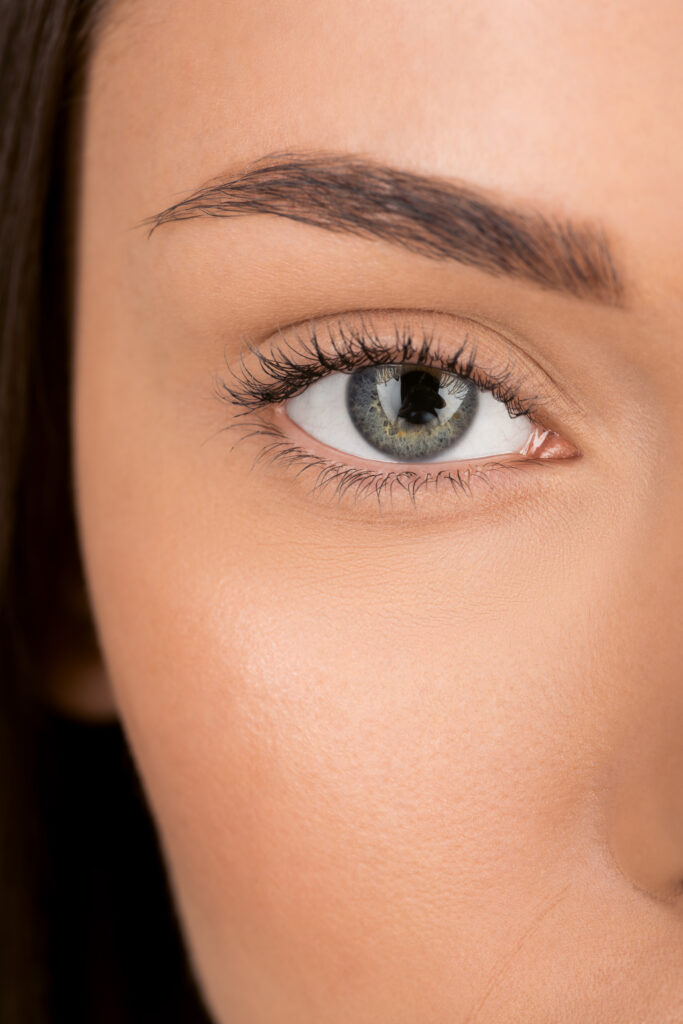 close-up shot of woman with beautiful eye looking at camera