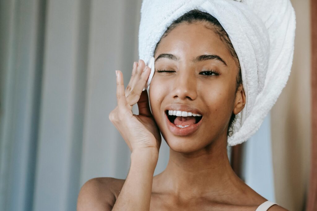 A lady trying to remove mascara at home