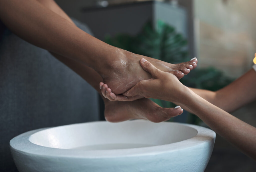 Closeup shot of an unrecognisable woman getting a foot treatment at a spa.