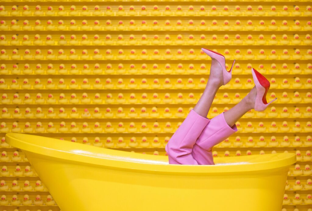Heel care. Feet care. Foot care. Pink pants with pink high heels.