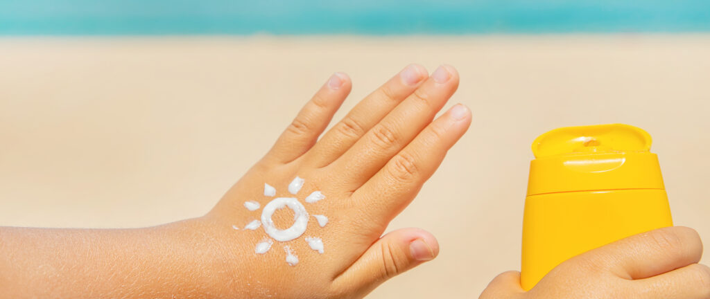 Sunscreen on the skin of a child. Selective focus. nature.