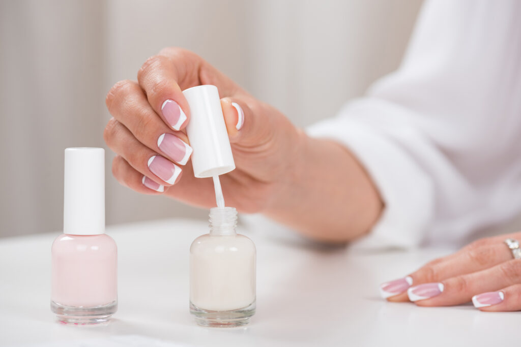 cropped shot of young woman applying nail polish while doing french manicureز OPI Gel Polishes