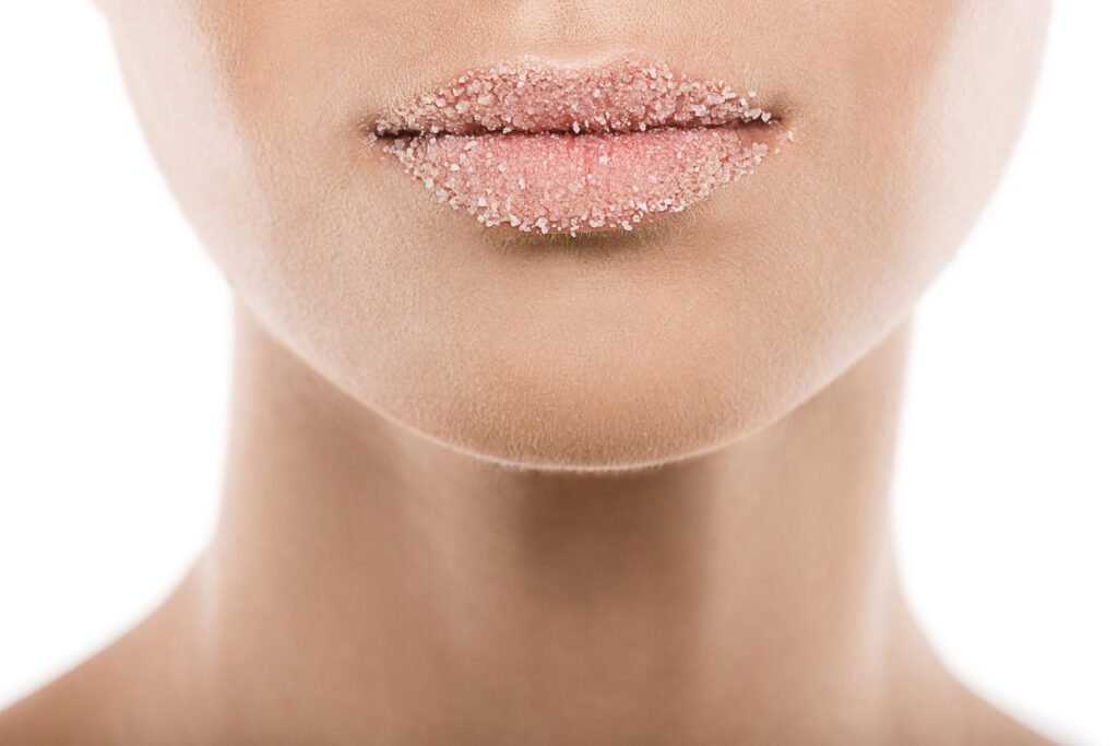 Alternatives to Lip Botox. Cropped view of woman with sweet sugar lips, isolated on white.