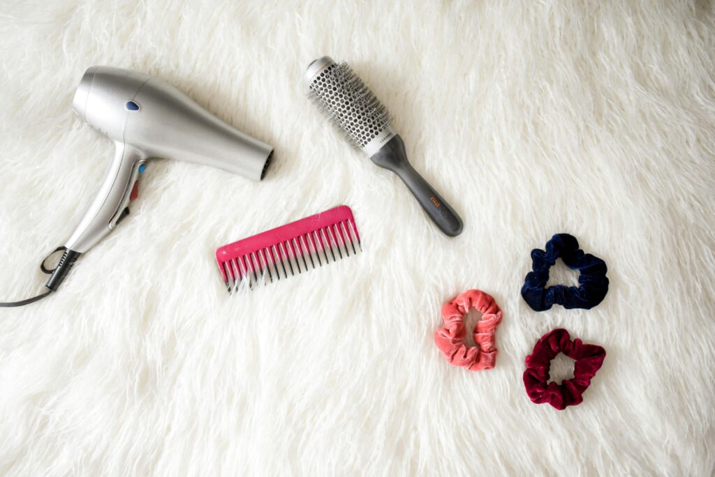 styling hair products. diy styling hair products. hair dryer. hair brusher. clips. 