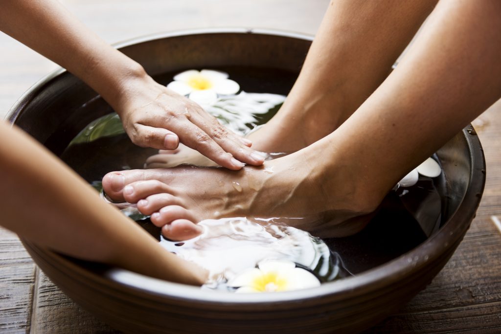 all-day care: from hair to toes! closeup of a foot spa. home spa. nail caring. 