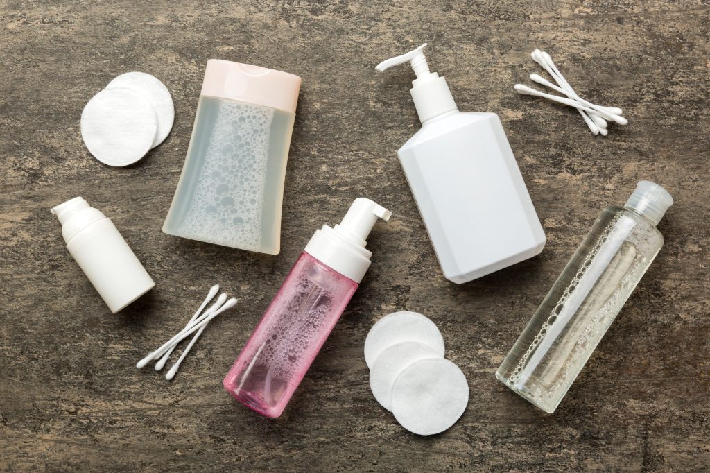 Mockup for bathing products top view flat lay, spa razor, toothpaste, soap, gel and other various accessories. Cosmetics for skin health. Bath Mockup for your logo.