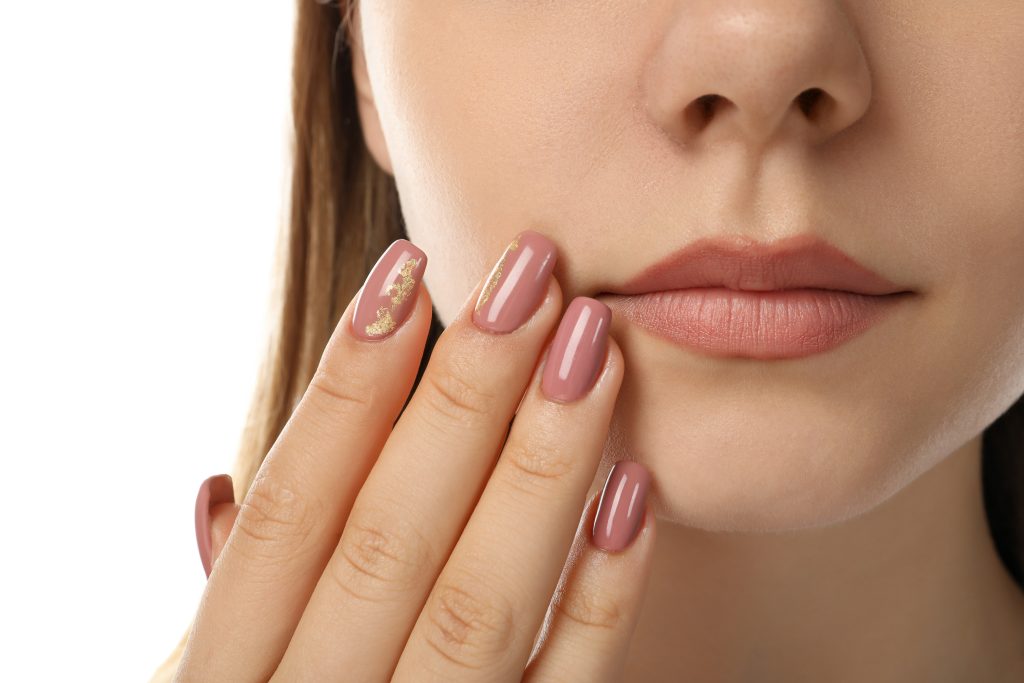 Concept of body care with young woman isolated on white background. gel polish. nail polish. manicure.