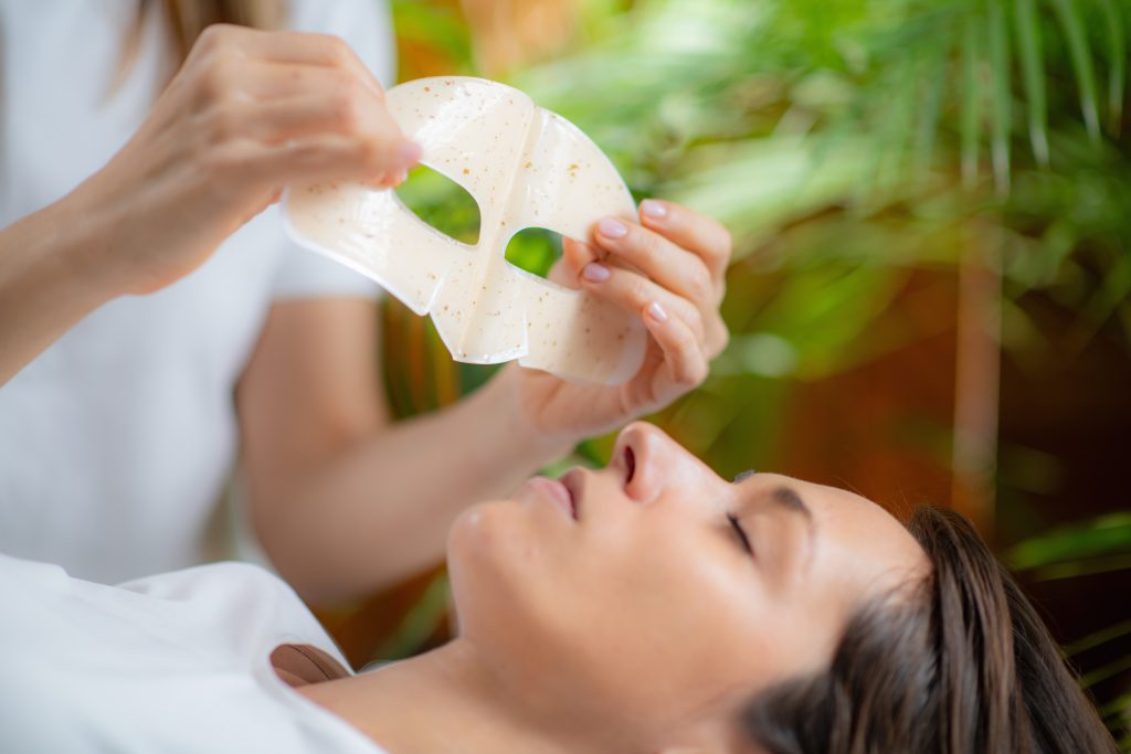 Types of Eye Masks. Pampering facial at the beauty salon as the cosmetician meticulously applies a rejuvenating face mask for skin care.