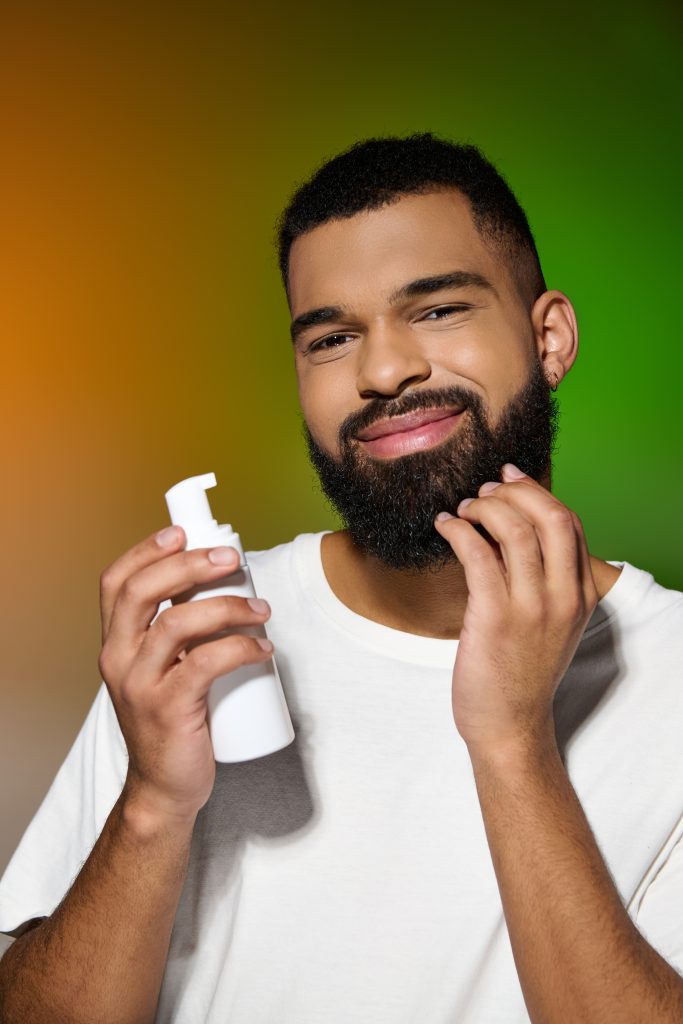 African american bearded man holds shaving cream. Step 4: Moisturizing and Hydrating