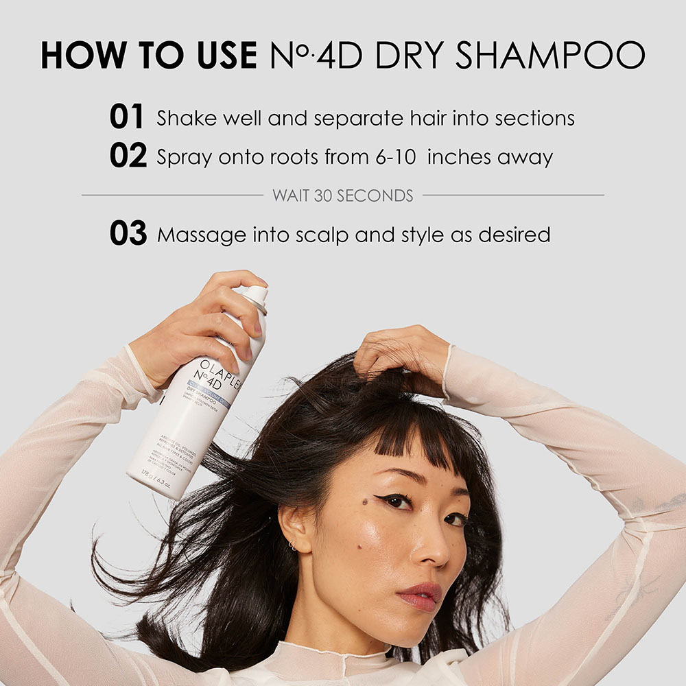 Olaplex No. 4D Detox Dry Shampoo: A beautiful woman applying Olaplex No. 4D Detox Dry Shampoo to her hair. Application directions: How to apply dry shampoo.