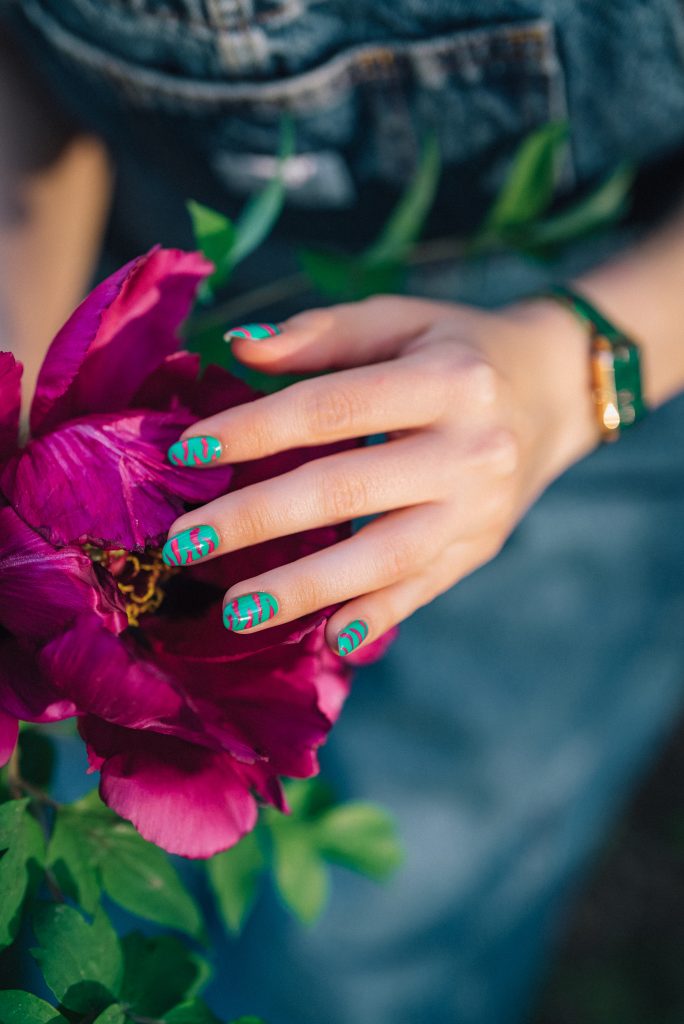 Nature-Inspired Nails. Creative vibrant pink nails art design, animalistic zebra pattern. Fuchsia color. Beautiful peony flower. High quality photo. 2025 nails.