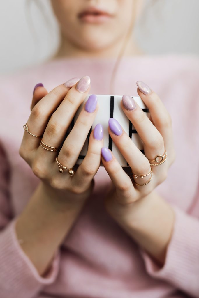 2025 ail trends. nail trends. new nail trends. Woman holding a cup of coffee. nail treatment. new nail designs. new trends.