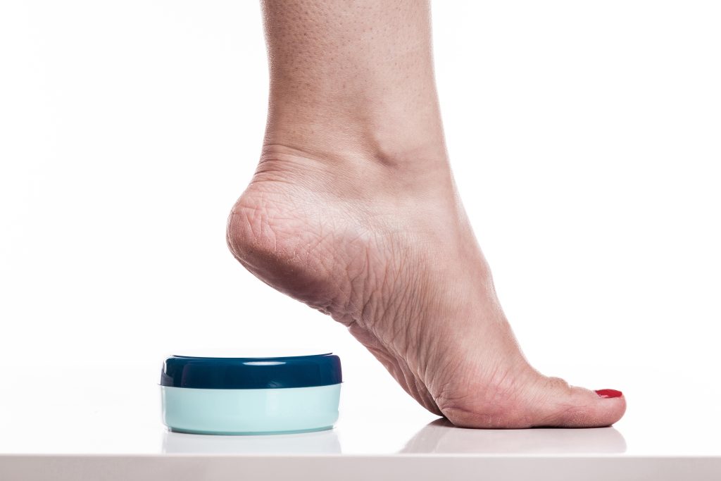care for dry skin on the well-groomed feet and heels with creams for the skin and feet.