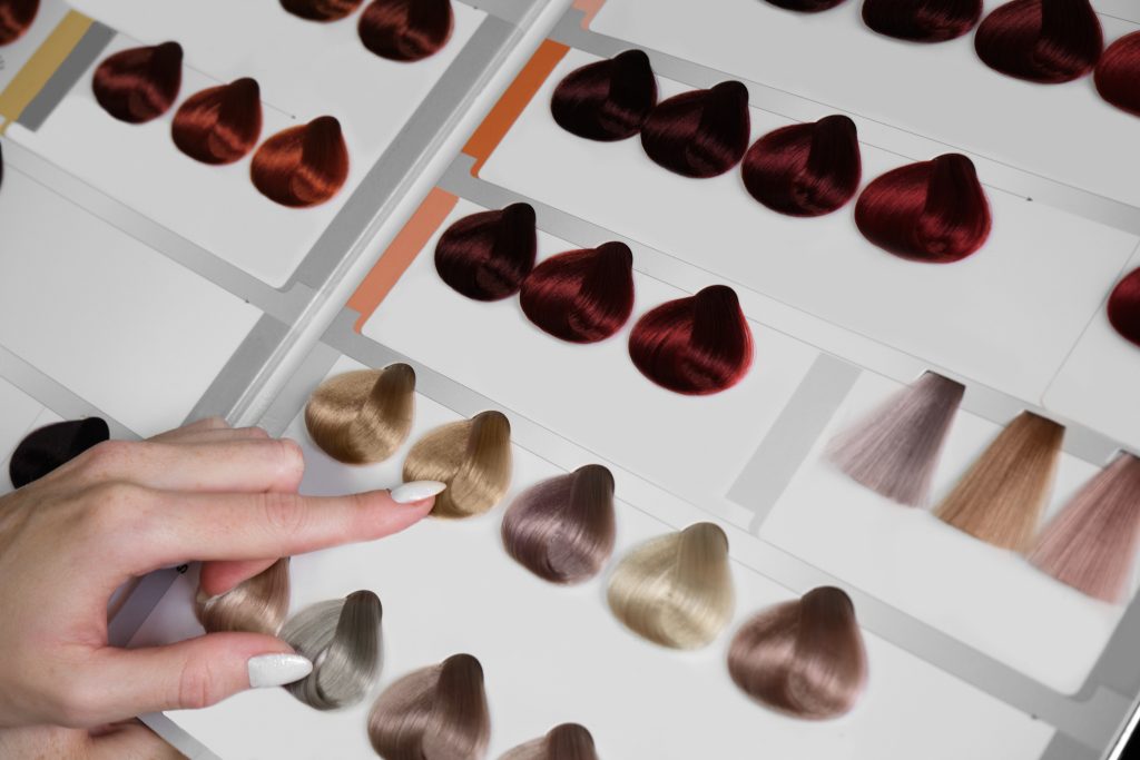 Close-up color palette for hair coloring in hairdresser's salon. top 2025 hair colors