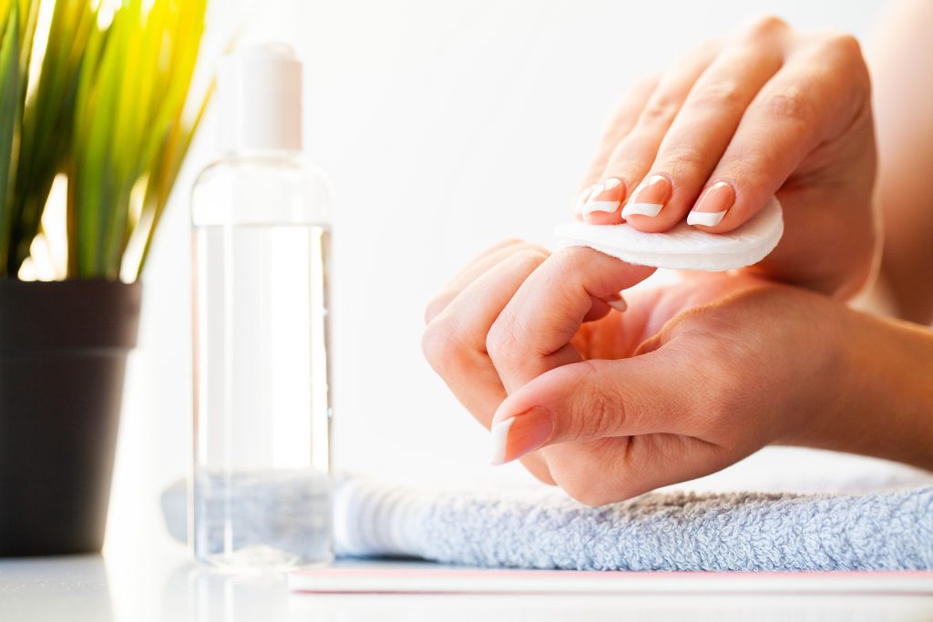 Nails care. Beautiful woman's nails with french manicure, in beauty studio. nail polish removers.