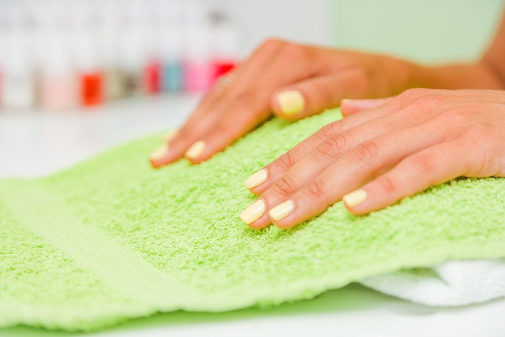 Woman getting her manicure done