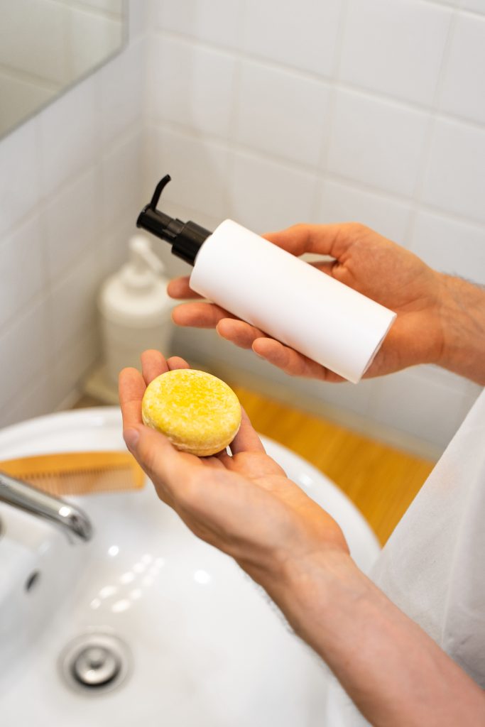 Why Choose Body Shower Gel Over Bar Soap? A man is choosing between a solid b\bar and a liquid one. Bathroom accessories. Plastic free, zero waste living, low water ingredients. Sustainable hair care. Responsibility for the nature.