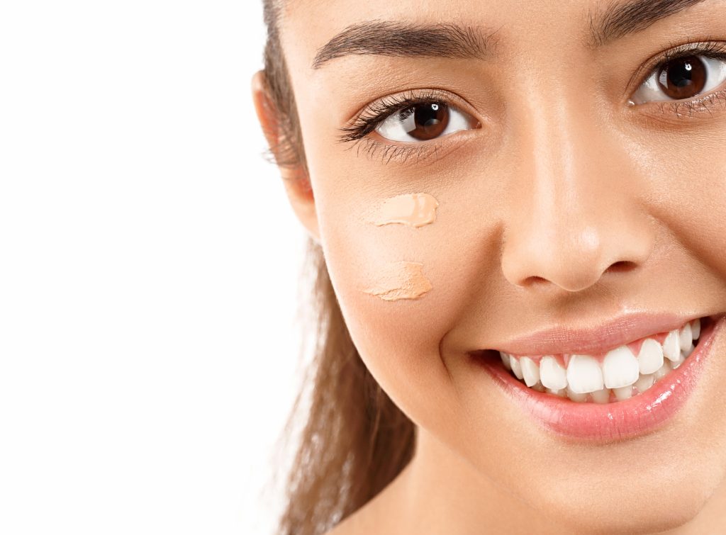 Concealer Mistakes. Portrait of girl woman with problem and clear skin creme, aging and youth concept with cream on face. applying concealer.