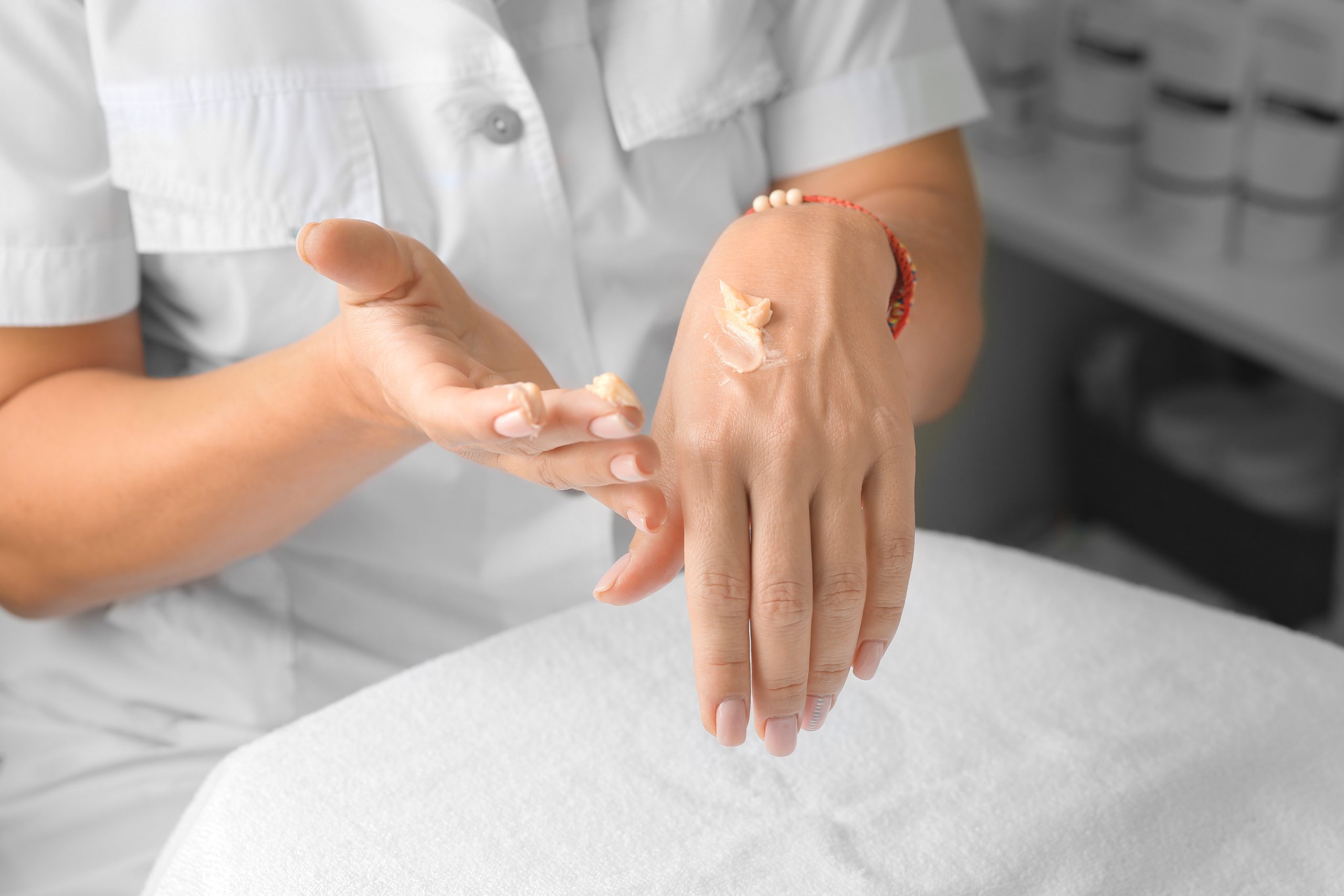 The Best After-Wax Lotions to Soothe and Refresh Your Skin. Cream on female hands. Applying cream to the hands. Hand skin care. Fashion and beauty. after wax lotion. lotion. skincare. body care.
