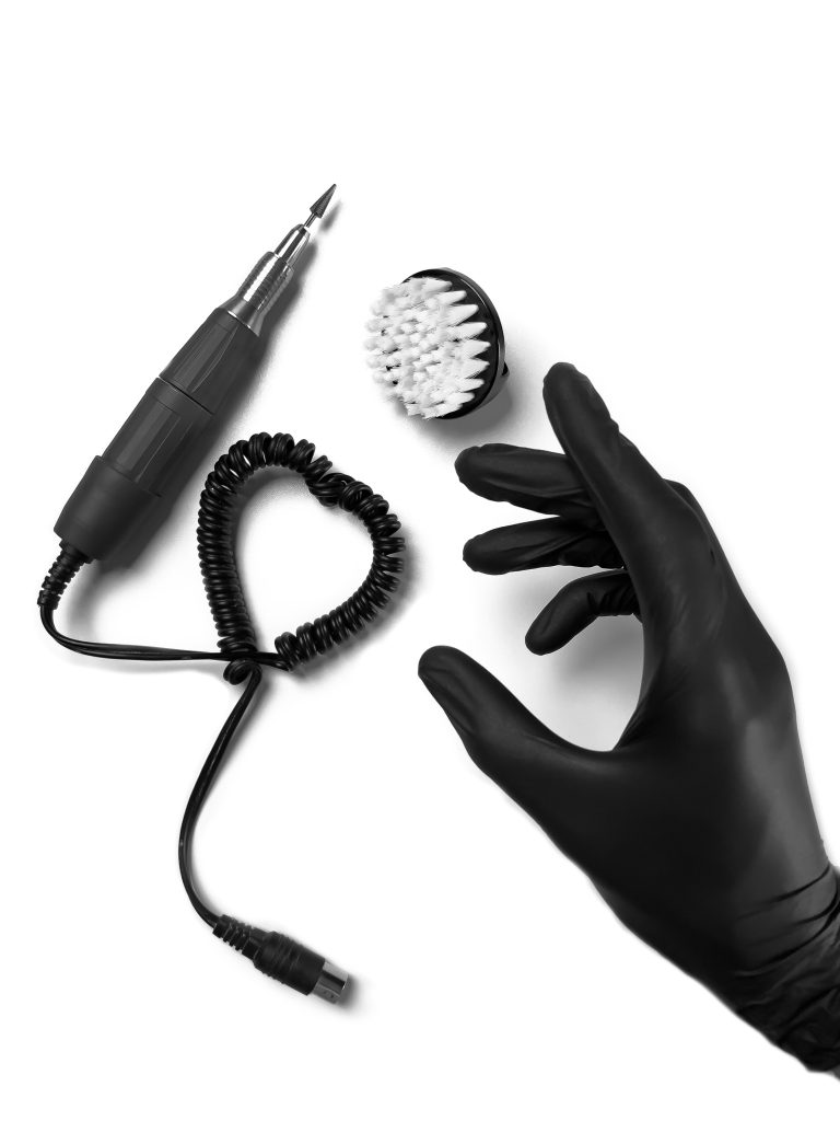 Cordless Nail Drills. Micromotor fraser with a nozzle, a tool for manicure. Nail salon. Close-up.